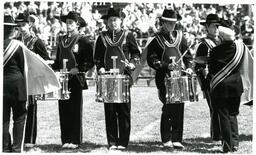 Line of Drummers Performing at Football Game (Part of the NMU Historic Photographs Collection)