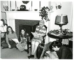 Woman and Students Singing in Living Room (Part of the NMU Historic Photographs Collection)