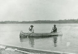 Menominee Joe and Jerome Dakota paddling near Eagle Island in Wisconsin