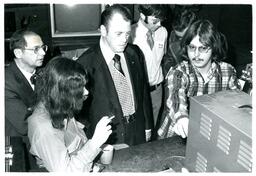 Jamrich and Men Watching Student Demonstrate Technology (Part of the NMU Historic Photographs Collection)