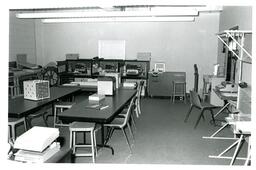 Empty Classroom with Technology on Tables (Part of the NMU Historic Photographs Collection)