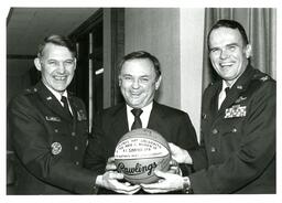 Goetze and Two Unknown Men Holding Signed K.I. Sawyer Basketball (Part of the NMU Historic Photographs Collection)