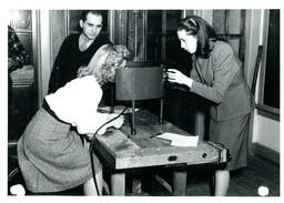 Two Women Doing Vision Test while Man Watches (Part of the NMU Historic Photographs Collection)