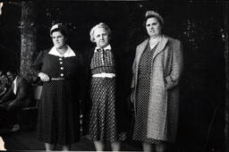 Three Women in Patterned Dresses