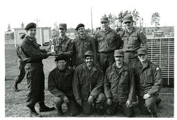 Group of Men in Military Uniforms Posing with Trophy (Part of the NMU Historic Photographs Collection)