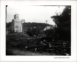 Large Metal Pipes in front of Unknown Copper Range Company Mine Shafthouse