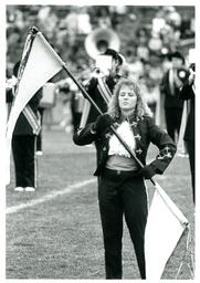 Closeup of Color Guard Member Performing on Football Field (Part of the NMU Historic Photographs Collection)