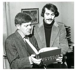 Two Men Reading a Physics Textbook (Part of the NMU Historic Photographs Collection)