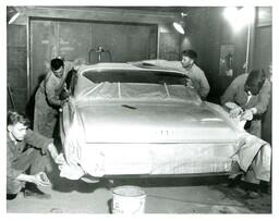 Four Students Sanding Car (Part of the NMU Historic Photographs Collection)