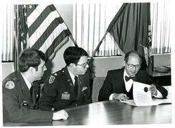 Davis, Turner, and John X. Jamrich Looking at Papers (Part of the NMU Historic Photographs Collection)