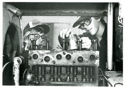 Two Students Working on Machine (Part of the NMU Historic Photographs Collection)