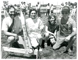 Three Adults and Child Pose Outside with Rocket (Part of the NMU Historic Photographs Collection)