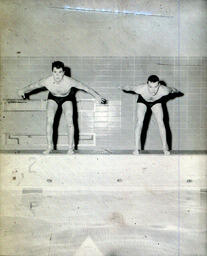 Swimming Team: Two Other Swimmers Prepare to Enter Water (Front)