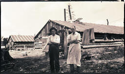 Men in front of Two Buildings