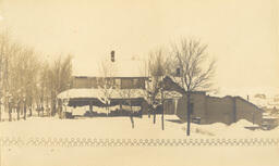 House in winter with laundry on porch