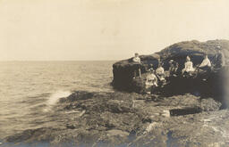 People on rock shoreline of Lake Superior (1 of 3)