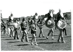 Marching Band Practicing in Field across from Dormitories (Part of the NMU Historic Photographs Collection)