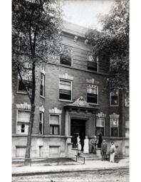 Five Adults and Child on Steps of Building