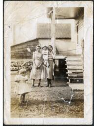 Patsy Limieux, Lottie (Perras) Limieux, James Lee Perras, and Lillian Perras by Back Porch