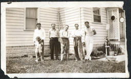 Group of Men Outside House