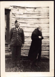 Soldier and Woman next to House (1 of 2)