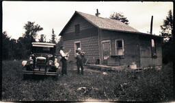 Men Playing Instruments in Front of House