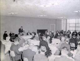 Superintendent and School Board Member Meeting 1961: View of Large Group of People at Tables