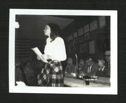 Girl Holding Paper at Banquet (1 of 2)