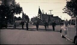 (016-007) Men in Military Uniforms Marching in Ontonagon Labor Day Parade