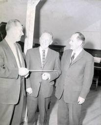 Music Department--Ray Uhlinger; Dr. Allen Niemi; Dr. Harold Wright March 1961: Three Men Standing Together, One Holding a Baton