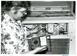 Man Testing Voltage of Machine (Part of the NMU Historic Photographs Collection)