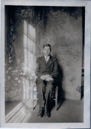 Boy in Front of Photo Backdrop