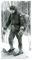 Man in Military Uniform Snowshoeing in Woods (Part of the NMU Historic Photographs Collection)