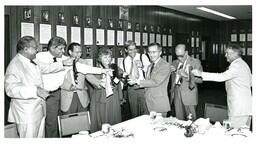 Group of People Cutting their Ties (Part of the NMU Historic Photographs Collection)