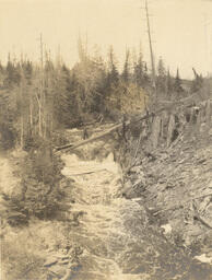 River and waterfall in the Upper Peninsula with person crossing river