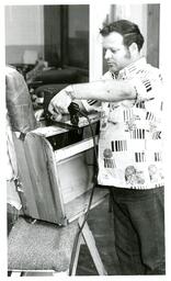 Man Using Nail Gun on Leather Chair (Part of the NMU Historic Photographs Collection)