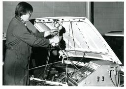 Student Checking Car Engine (Part of the NMU Historic Photographs Collection)