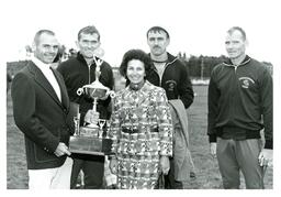 Four Men and Woman Posing with Trophy (Part of the NMU Historic Photographs Collection)