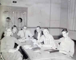 Unknown--Students at a Desk: Six Students Posed Sitting at Desk, Smiling at Camera