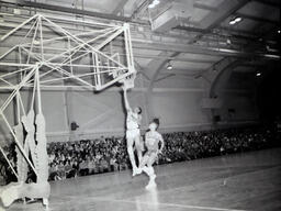 NMC Alumni Basketball 1960-61: Man Attempting to Score in Basketball Game