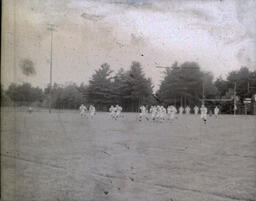 Football ca. 1960: Distance Photo of Players in White Uniforms Playing