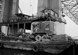 Crane aloft under Mackinac Bridge