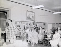 Artist J. Martin Summer 1958: View of Small Group Watching Martin Paint