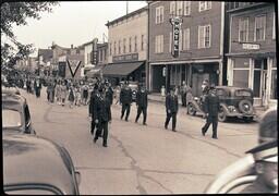 (050-024) Men in Uniforms March Past the Holly Hotel