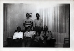 Group Photo of Men in Living Room