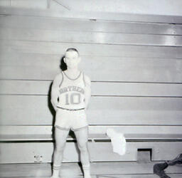 NMC Basketball--Individual Pictures 1960-61: Basketball Player No. 10 Posing for Photo