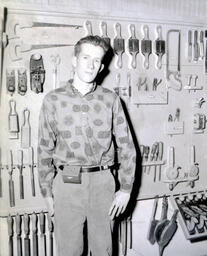 Industrial Arts Instructor Paul Mattson, ___student and bait box May 1961: Paul Mattson Smiling With Closed Mouth