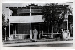 Woman Walking Into House