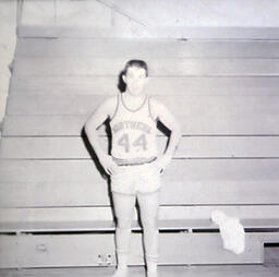 NMC Basketball--Individual Pictures 1960-61: Basketball Player No. 44 Posing for Photo