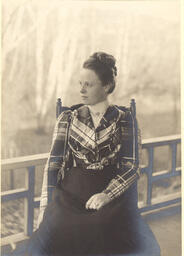 Portrait of a woman wearing a plaid jacket